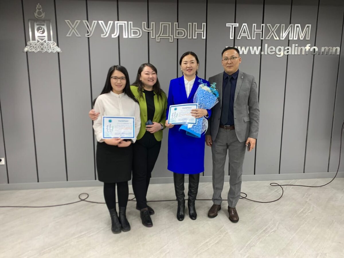 Oyunchimeg Ayush (wearing blue in the photo), then the head of the Mongolian state agency responsible for public defense.