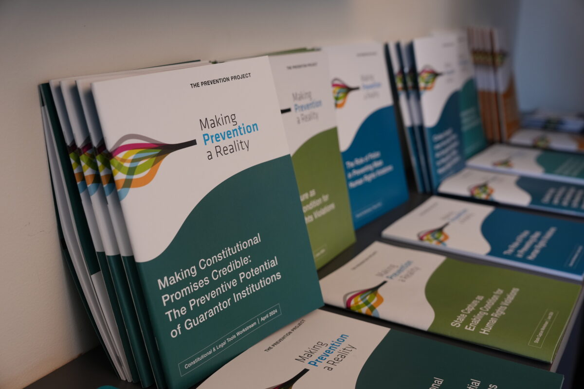 Prevention Project policy reports on preventing mass human rights violations displayed at CHRGJ workshop with UN partners